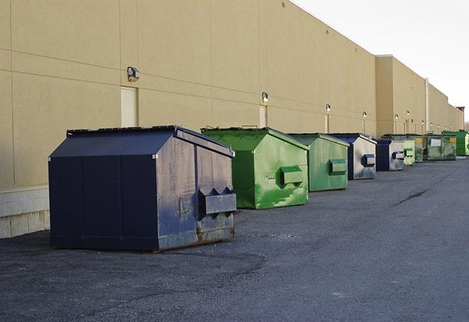 industrial garbage dumpsters filled with discarded materials in Springfield